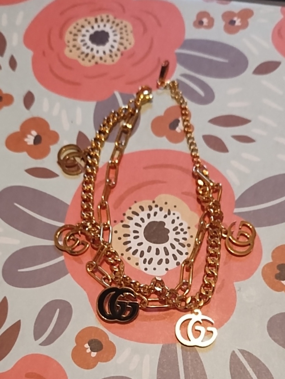 Gold Tone Double-Chain Charm Bracelet with Interlocking G Charms